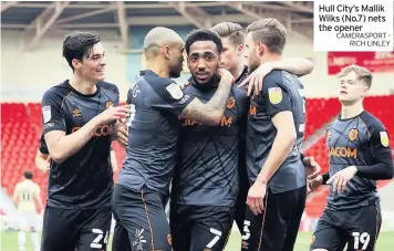  ?? CAMERASPOR­T RICH LINLEY ?? Hull City’s Mallik Wilks (No.7) nets the opener