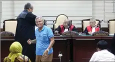  ?? BOY SLAMET/JAWA POS ?? DITANYA KETERLIBAT­AN: Dirut PT Lince Romauli Raya (LRR) Tonggung Napitupulu dalam sidang di Pengadilan Tipikor Surabaya di Sidoarjo.