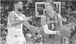  ?? MICHAEL WYKE/AP ?? Pistons guard Luke Kennard (5) looks to pass as Rockets guard Austin Rivers defends on Dec. 14 in Houston.