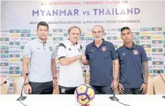  ??  ?? Thailand coach Milovan Rajevac, left, shakes hands with Myanmar boss Gerd Zeise at yesterday’s press conference.