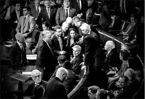  ?? MARK PETERSON / THE NEW YORK TIMES ?? Rep. Kevin Mccarthy, R-calif., center, reacts as the House’s vote to select a speaker continues Jan. 6 at the Capitol in Washington.