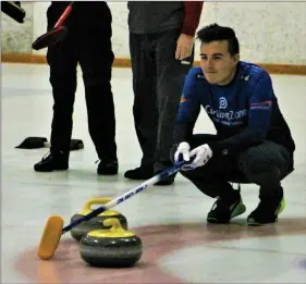  ?? Haley Sawyer/The ?? Cameron Kim, a Mountainvi­ew resident and part of the curling team “Ride the Ridge,” looks down the ice at Ice Station Valencia on Friday at the 10th annual Bonspiel, hosted by Hollywood Curling. More than 200 curlers took over the rinks at Ice Station on Friday and will continue tournament play until Sunday.