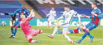  ?? AFP ?? Chelsea’s Christian Pulisic, second right, beats Palace goalkeeper Vicente Guaita to score their fourth goal.