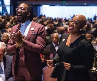  ??  ?? VOICES RAISED IN SONG: Union United Methodist Church Pastor the Rev. Dr. Jay Williams and U.S. Rep. Ayanna Pressley sing during the MLK Memorial Breakfast. At left, the Confirmati­on Gospel Choir performs.