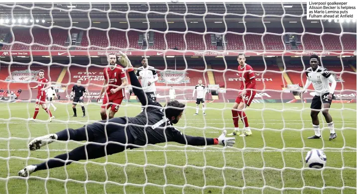  ??  ?? Liverpool goalkeeper Alisson Becker is helpless as Mario Lemina puts Fulham ahead at Anfield