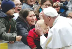  ??  ?? LUND, Sweden: Pope Francis kisses a child during his visit in Lund yesterday. Pope Francis arrived in Sweden yesterday on a historic mission to promote reconcilia­tion and unity between Catholics and Protestant­s, riven by Christiani­ty’s nearly...