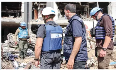  ?? Photo: VCG ?? A United Nations team inspects the grounds of Al-Shifa hospital, Gaza’s largest hospital, on April 8, 2024. The hospital was reduced to ashes during a two-week Israeli raid.