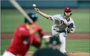  ?? CHARLES KRUPA — THE ASSOCIATED PRESS ?? Phillies starter Aaron Nola delivers during the first inning at Fenway Park in Boston on Tuesday.