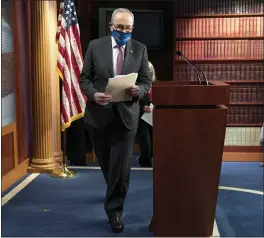  ?? JACQUELYN MARTIN — THE ASSOCIATED PRESS ?? Senate Majority Leader Chuck Schumer, D-N.Y., arrives to speak to the media, Tuesday on Capitol Hill in Washington.