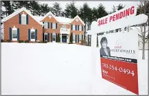  ?? (AP) ?? In this file photo a real estate sale pending sign hangs in front of an existing home in Walpole, Mass. On Feb 15, Freddie Mac reports on this week’s
average US mortgage rates.