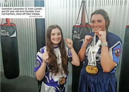  ?? HEULWEN EVANS ?? Gwenllian Carpenter, 13, from Llanelli, and 24 year-old Amy Humble, from Carmarthen, show off their medals.