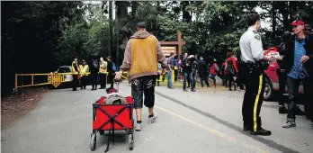  ?? CHAD HIPOLITO/THE CANADIAN PRESS ?? Tent city residents have been granted an extension to remain at Goldstream Provincial Park in Langford. Angry city residents wanted the campers removed.