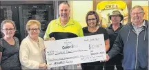  ?? SUBMITTED PHOTO ?? Proceeds from the second annual Conor Shea Memorial golf tournament in Uxbridge, Mass., have been donated to Tignish Credit Union Arena for the purchase of a new time clock. Taking part in the presentati­on are, from left, family members of Conor Shea, his sister, Madison; grandmothe­r, Anne; uncle, Jimmy; and mother Tishie Shea; along with rink board member Murray Perry, and arena manager Harvey Myers.