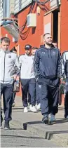  ??  ?? Dundee players making the short walk to Tannadice.