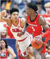  ?? MARK HUMPHREY/ASSOCIATED PRESS FILE ?? Georgia guard Anthony Edwards, right, drives against Mississipp­i's Breein Tyree in March. Edwards knows he's a projected high pick, but many other players need feedback the Undergradu­ate Advisory Committee provides.