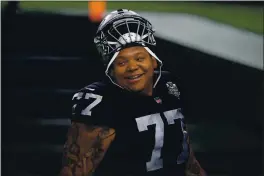  ?? ETHAN MILLER — GETTY IMAGES, FILE ?? Trent Brown looks on during the first half of a Dec. 17 game between the Raiders and Chargers at Allegiant Stadium in Las Vegas. The Raiders on Tuesday dealt the 6-foot-8, 380-pound Brown to the Patriots for a 2022 fifth-round pick, a team source confirmed to the Bay Area News Group.