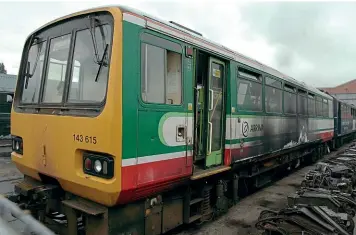  ??  ?? Two ‘143s’, Nos. 143613/15, succumbed to fire damage in 2004. The scorch marks are clearly evident on No. 143615 as it sits at Crewe on September 10, 2005 awaiting a decision on its future. Both ‘Pacers’ were eventually scrapped.