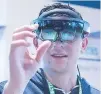  ?? CREDIT: SUPPLIED ?? Students at the BCIT Tech Lounge use the Microsoft HoloLens to take apart an automotive transmissi­on at the recent BC Tech Summit.