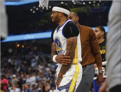  ?? NHAT V. MEYER — BAY AREA NEWS GROUP ?? The Warriors’ Gary Payton II holds his arm after being fouled against the Memphis Grizzlies in the first quarter of Game 2in Memphis, Tenn., on Tuesday.