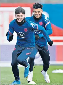  ??  ?? England players limbered up for tonight’s match against San Marino by showing off their sprinting powers at St George’s Park, with (left) Ollie Watkins giving chase to Mason Mount, and (right) Phil Foden trying to lay a glove on Manchester City club-mate Raheem Sterling