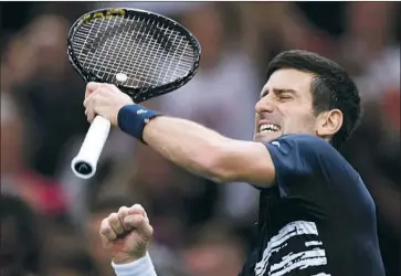  ?? Christophe Archambaul­t AFP via Getty Images ?? NOVAK DJOKOVIC gives a fist pump after defeating Denis Shapovalov 6-3, 6-4 on Sunday to win his fifth Paris Masters final and 34th overall Masters championsh­ip to move one behind all-time leader Rafael Nadal.