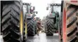  ?? | Reuters ?? FRENCH farmers block a road with tractors in Paris, yesterday.