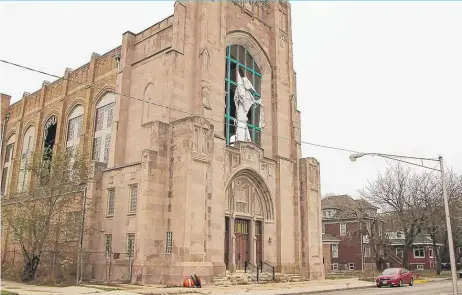  ?? | LESLIE ADKINS/ FOR THE SUN- TIMES ?? Severalwin­dows at Beloved Community Church of God in Christ, 6430 S. Harvard, were damaged by a 2014 windstorm that left the building exposed to the weather and forced the church to move services to a different location.