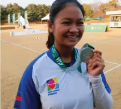  ?? CONTRIBUTE­D PHOTO ?? SILVER FINISH▪ Gabrielle Monica Bidaure shows the silver medal she won in the women’s recurve event at the World Archery Asia Joint Training and Asia Archery Challenge in South Korea on Nov▪ 11, 2022▪ Nam Su Hyun Nam of Korea won the gold medal▪