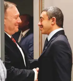  ?? AFP ?? Shaikh Abdullah Bin Zayed greets US Secretary of State Mike Pompeo ahead of the peace summit in Berlin.