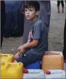  ?? ?? DESPERATE: A boy at a water point in Rafah, on the Gaza/Egypt border