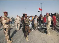  ?? Reuters ?? Iraqi soldiers at Umm Qasr Port, south of Basra, after it was closed by protesters