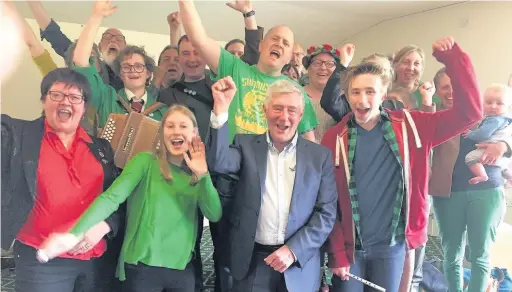  ??  ?? ●●Rochdale MP Tony Lloyd celebrates his election victory with the Oakenhoof Cloggers at Rochdale’s Labour Party HQ