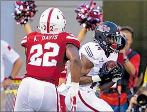  ?? AP/NATI HARNIK ?? Arkansas State wide receiver Chris Murray (14) caught a 29-yard touchdown pass from Justice Hansen in the first quarter of the Red Wolves’ 43-36 loss to Nebraska Saturday night in Lincoln, Neb. The Red Wolves drove to the Nebraska 11 in the closing...