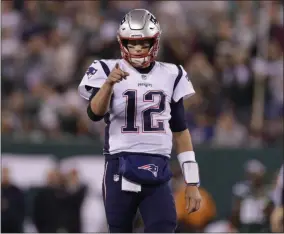  ?? ADAM HUNGER - THE ASSOCIATED PRESS ?? New England Patriots quarterbac­k Tom Brady (12) points to Benjamin Watson (84) after a play during the first half of an NFL football game against the New York Jets, Monday, Oct. 21, 2019, in East Rutherford, N.J.