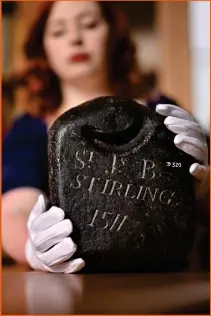  ?? ?? Left, Nicola Wilson, collection manager at The Stirling Smith Art Gallery and Museum, holds a curling stone said to be the world’s oldest, dating from 1511