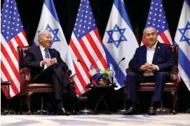  ?? ?? Joe Biden visits with Benjamin Netanyahu in Israel on 18 October. Photograph: Evelyn Hockstein/Reuters