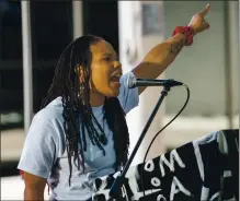  ?? DYLAN BOUSCHER — STAFF PHOTOGRAPH­ER ?? LaToya Fernandez, a restorativ­e justice coordinato­r, speaks during a Juneteenth youth rally at the James P. McEntee Sr. Plaza in front of the Juvenile Justice Center in San Jose on Friday.