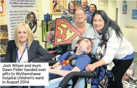  ??  ?? Josh Wilson and mum Dawn Fidler handed over gifts to Wythenshaw­e hospital children’s ward in August 2014