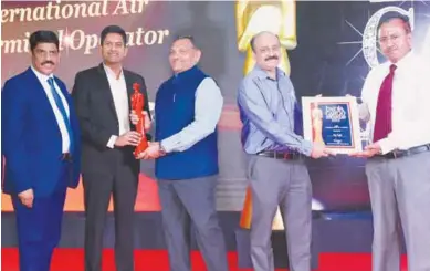  ?? ?? Ramkumar Govindaraj­an, CEO, Wiz Freight; Satish Lakkaraju and Vikrant Singh receiving Most Promising Start Up – Logistics Award at the recent India Cargo Awards