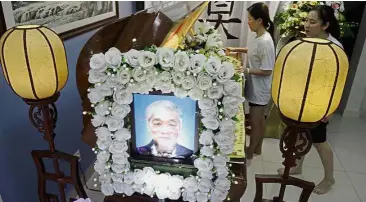  ??  ?? Solemn: Ah Kiew’s wake was held at his son Hock Beng’s house in Solok Tembaga in Island Glades, Penang.