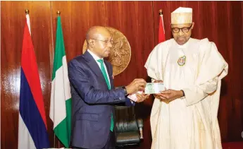  ?? ?? President Muhammadu Buhari ( right) and Governor, Central Bank of Nigeria ( CBN), Godwin Emefiele at the unveiling of redesigned naira notes in Abuja... yesterday.