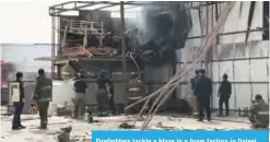  ??  ?? Firefighte­rs tackle a blaze in a foam factory in Dajeej.