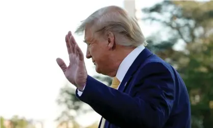  ??  ?? Donald Trump waves as he walks on the South Lawn of the White House on 11 October. Photograph: Yuri Gripas/Reuters