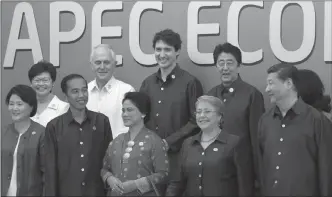  ?? The Canadian Press ?? Canadian Prime Minister Justin Trudeau takes part with other leaders in the APEC Leaders official photograph at the APEC Summit in Danang, Vietnam Friday.