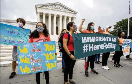  ?? MANUEL BALCE CENETA / ASSOCIATED PRESS ?? Deferred Action for Childhood Arrivals students celebrate in front of the U.S. Supreme Court after the justices rejected by a 5-4 ruling President Donald Trump’s bid to end legal protection­s for young immigrants Thursday.