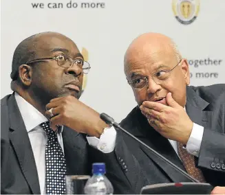  ?? Picture: TREVOR SAMSON ?? A WORD IN YOUR EAR: New Finance Minister Nhlanhla Nene, left, and predecesso­r Pravin Gordhan. Nene is known to agree with the former minister’s macroecono­mic philosophy