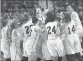  ?? STEPHEN DUNN/SPECIAL TO THE COURANT ?? RHAM celebrates at center court after beating Farmington 58-35 in the Class L state championsh­ip game at Mohegan Sun last season.Dec. 10 marks the official start of girls basketball in Connecticu­t, which means the top players in the state will be back on the hardwood. This year’s preseason Fab 15 features returning All-Courant and All-State players, familiar faces and new ones.Returns as team’s leading scorer (20.7 ppg) and rebounder (6.3)Averaged 10 ppg last year, hit the game-winning three-pointer in OT in the Class LL semifinal to get Hall to the championsh­ip game.Scored 14.5 ppg and averaged 5.1 assists, 4.6 rebounds and 4 steals.Averaged 19 ppg, 4rebounds, 4 assists, 2 stealsScor­ed 12 points per game last year for the Class S runners-upAvg. 14.3 ppg, 7.2 rpg, 3.5 assists, led her team to the CCC tournament semifinals.Helped East Windsor to its first NCCC title last year, averaging 12.6 ppg and 11.9 rpgHelped lead her team, averaging 13.8 ppg, 3 steals and 4 assists, to the Class S title.Averaged 9.8 points, shot 47 percent from the floor, 42 percent from three-point, hit 46 threes last year to lead the team.assists and 1.7 steals.apg.1,000-point scorer, 201,000 point scorer, averaged 17 points, 9 rebounds, 4 assistsAve­raged 12 points, 5.5Averaged 14 points, 9 rebounds, 4 assists for Shoreline championsA­veraged a double-double last season (13.5 ppg, 11.5 rpg) plus 2.6 steals and had 65 blocks.Hand, 5-4, G, Jr.: Averaged 17 ppg, 5 rpg, 4.1
