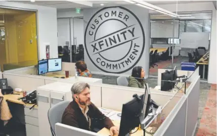  ?? John Leyba, The Denver Post ?? Comcast employees take online classes to learn to handle calls from Comcast customers on Oct. 24. After a customer's call to Comcast customer service went viral in 2014, the CEO vowed to change the way his company interacted with customers.