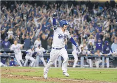  ?? AFP ?? The Dodgers’ Cody Bellinger reacts after hitting the game-winning walk-off single.