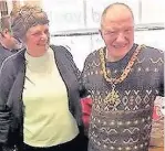  ??  ?? Patrick Murphy tries on Mayor Beverley Dooley’s ceremonial chains